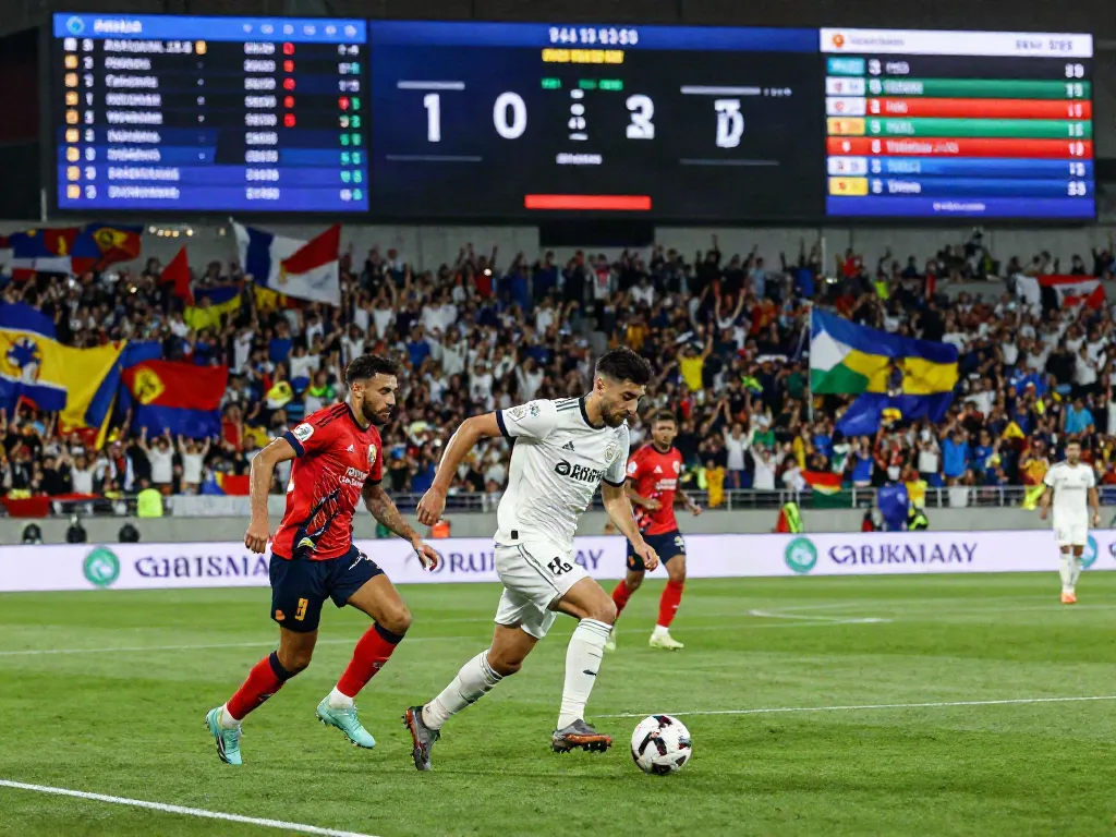 TOP10 นักเตะ showcasing a thrilling football match atmosphere with fans and action.